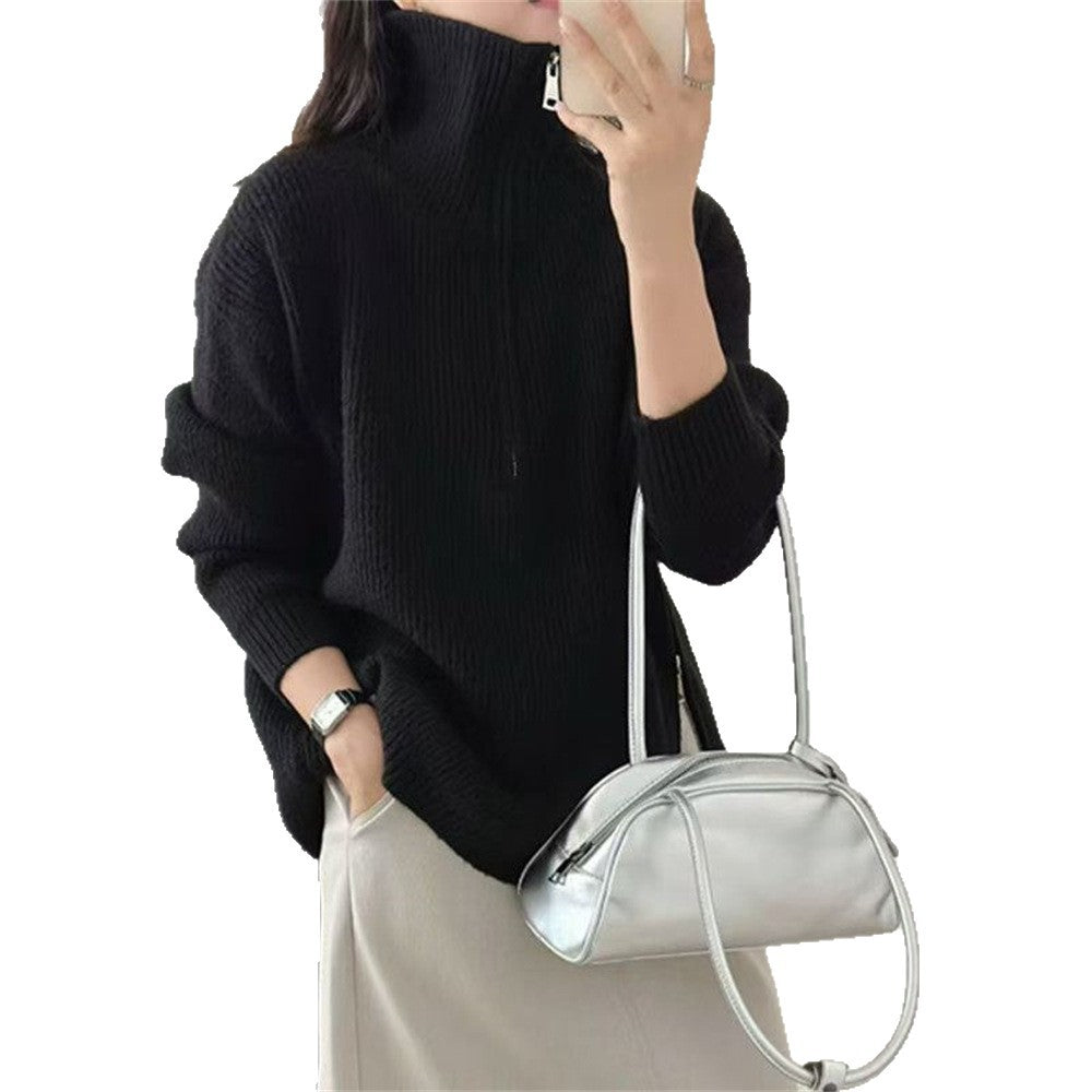 Loose long sleeved sweater with slit hem